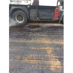 Protection for Asphalt-Coated Manhole Cover