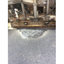 Protection for Asphalt-Coated Manhole Cover