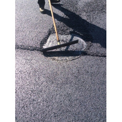 Protection for Asphalt-Coated Manhole Cover