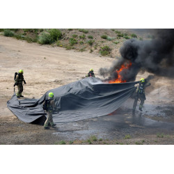 PRO fire blanket deployed by four firefighters over a burning vehicle
