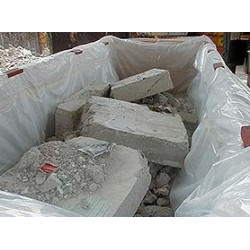 Dumpster liner marked "Asbestos"
